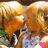 Animated contact sheet showing two frames of a cartoon character kissing with pink hearts, rendered in low-resolution pixel art style on gray background.
