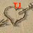A heart-shaped icon with a hand holding a pen drawing it on sand, featuring red text above the heart.