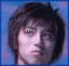 Three pixelated faces with blue backgrounds, two text below showing 'w-inds. secret base' in light blue on purple gradient