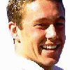 small images showing a person in various poses and outfits, including smiling, crouching with a rugby ball, and wearing a sports jersey with 'WILKINSON 10' text