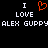 Black background with white pixelated text reading "I LOVE ALEX GUPPY" and an orange pixelated heart symbol between two "I" letters.