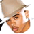 Pixelated static image of a person with light brown hair wearing a white shirt, partially visible on the left side showing black and white elements.