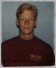 A person in a maroon shirt against a light blue background with changing eye and head positions