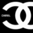 Black and white pixelated icon featuring a stylized letter 'O' with an oval cutout, surrounded by curved shapes on a black background.