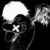 A black-and-white animated icon shows a skull with glowing eyes and an X-shaped mouth, transitioning to reveal a winged figure holding a weapon.