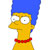 Pixelated character with blue hair, yellow skin, and red collar, facing left with wide eyes.