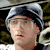 Animated contact sheet showing three frames of a person wearing beanies and headphones in outdoor settings with visible facial features, clothing details, and background elements.
