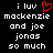 Black background with white pixelated text reading 'i luv mackenzie and joe jonas so much' and a red pixelated heart symbol replacing the 'o' in 'luv' on the left side.