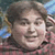 Static 50x50 pixel icon showing a close-up of a person's face with curly hair, visible in low-resolution pixels without clear facial features or text.