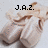 A pixelated image of a light brown fabric object with text overlays reading J.A.Z., DANCE, and AND MORE in black block letters.