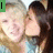Two people in a close-up pose with one person kissing the other's cheek, text overlays change across frames.