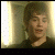 A sequence of five pixelated frames showing a person in dark clothing against warm-toned backgrounds with vertical light strips, displaying changing facial expressions and head positions.