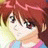 Pixelated anime-style close-up of a character with brown hair and green eyes, wearing a light-colored top with blue and pink accents against a blurred background.