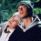 Animated sequence showing three distinct scenes: a person in medieval attire holding an infant, two people embracing outdoors, and two smiling individuals close together.