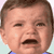 Pixelated close-up of a child's face with brown hair, open mouth, and squinted eyes against light background.