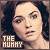 Pixelated close-up of a person with dark hair and light skin, featuring text reading THE MUMMY in blocky letters at bottom left.