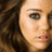 Static pixelated image of a person's face with dark hair and light skin, cropped to show eyes, nose, mouth, and part of the forehead.