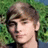 A pixelated image shows a person with light brown hair against green foliage, next to pink text reading "He's Mine!!" on dark green background.