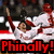 Pixelated image of a person in white and red clothing with arms raised, overlaid by bold red text reading "Phinally!" on a black background.