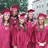 Group of five people in pink graduation gowns and caps standing outdoors with text "Graduation 2008" on the right.