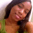 Pixelated close-up of a person with dark hair, light skin tone, and visible facial features including eyes, nose, mouth, and cheeks.
