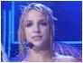 Britney Spears in three distinct stage poses: close-up with microphone, group dance under purple umbrella, and solo against pink background