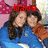 Two people in blue and orange clothing embrace against a pink polka-dot background with red text above them.
