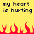 Yellow background with dark blue text reading 'my heart is hurting' repeated twice, red pixelated flames at the bottom.