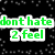 Pixelated text phrases in green, yellow, and orange on a black background with white speckles; gray rectangle partially covers lower right.