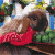 A pixelated image shows a person in red clothing holding an animal, with green text reading 'Original Icons .com' on the right side.