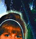 Animated cartoon character with brown hair and a dark hooded garment, showing eye movement against a blurred outdoor background.