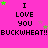 Pixelated pink background with repeated text and star symbols in green, purple, and white.