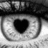 A black-and-white close-up of a human eye with heart-shaped pupils, overlaid with pink text reading "Everything Happens For A Reason" across six