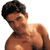 Static pixelated image of a shirtless man with dark hair and light skin, cropped to show upper torso against white background.