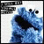 Blue furry character with large black eyes and open mouth, displayed in a of four with partial text above each
