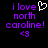 Pixelated purple text reads 'i love north caroline!' with a white heart symbol and '<3' symbol on black background.