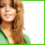 A static pixelated image shows a person with long brown hair wearing a green top against a white background bordered by green.