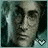 A pixelated image of a person with dark hair and glasses, wearing a light-colored shirt against a teal background with vertical white stripes.