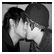 Black-and-white pixelated image of two people kissing, with text reading "Cheer Up Emo Kid" to the right.
