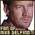 Pixelated close-up of a person's face with visible ear and neck, overlaid by text reading 'FAN OF MIKE GELFINO' in blocky white letters on dark background.