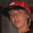 A pixelated image of a person wearing a red cap with white patterns, positioned next to cyan text reading "i love" and "toge" on black backgrounds.