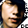 nine identical pixelated faces with varying mouth positions, surrounded by partial text fragments on a gray background