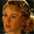 Static close-up of a woman's face with vintage-style curled hair, rendered in low-resolution pixelated style against dark background.