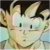 Pixelated static image of a character with light skin, dark hair, and a wide smile, set against a blurred background with green and blue tones.