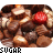 Pixelated image of chocolate candies with a red candy on top, featuring text and heart symbols.