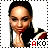 A person with dark hair pulled back wears a black, white, and red striped top, hands clasped near the chin, with 'AKO' text in red and black below.