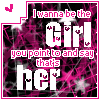 Pixelated graphic with pink and black background displaying text "I wanna be the Girl you point to and say that's her" in white and pink lettering, bordered by a pink frame.