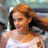 Static 48x48 pixel buddy icon showing a person with long red hair wearing a white sleeveless top against a blurred background.