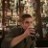 Pixelated static image of a person in motion with blurred background elements.