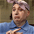 A pixelated contact sheet showing two frames of an animated icon featuring a character from Austin Powers: Goldmember on the left and green text "Original Icons .com" on the right against a dark background.